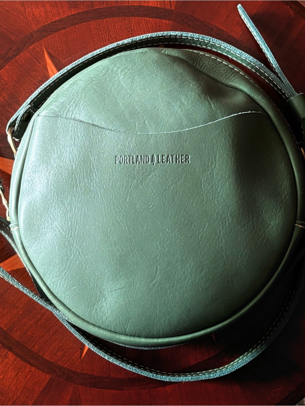 Portland Leather 9 inch Round Crossbody Bag in Eucalyptus green